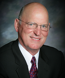 Professional headshot of E. Larry Sikes, CPA/PFS and CERTIFIED FINANCIAL PLANNER™ professional at Darnall, Sikes & Frederick.